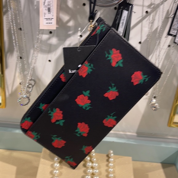 Kate Spade Lucy Medium L-Zip Wristlet
COLOR:
Black Multi
NWT - Picture 14 of 16